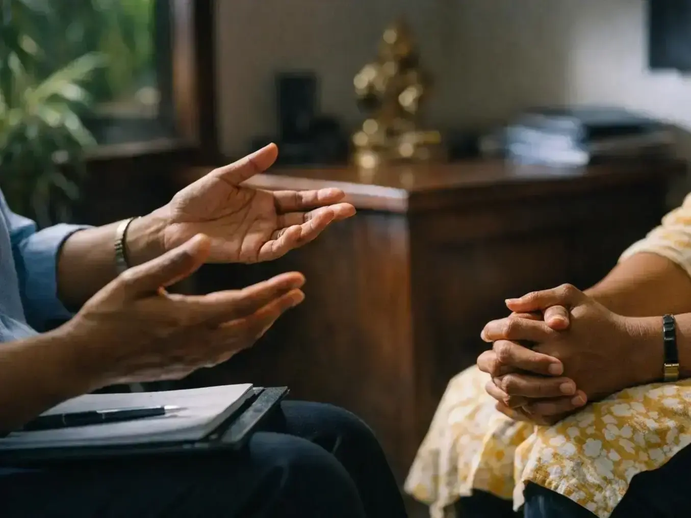 Therapist taking notes during personalized mental health assessment in Kanayannur clinic